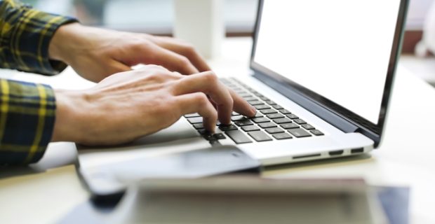 Man hands working on laptop