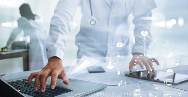 Doctor touching medical icon network connection on laptop and tablet with modern virtual screen interface, medical technology network concept