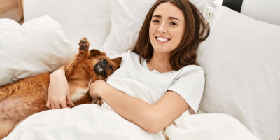 pet and tutor on bed