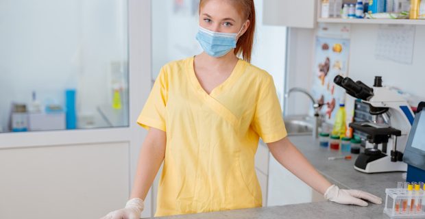 Woman vet standing in interior of modern clinic