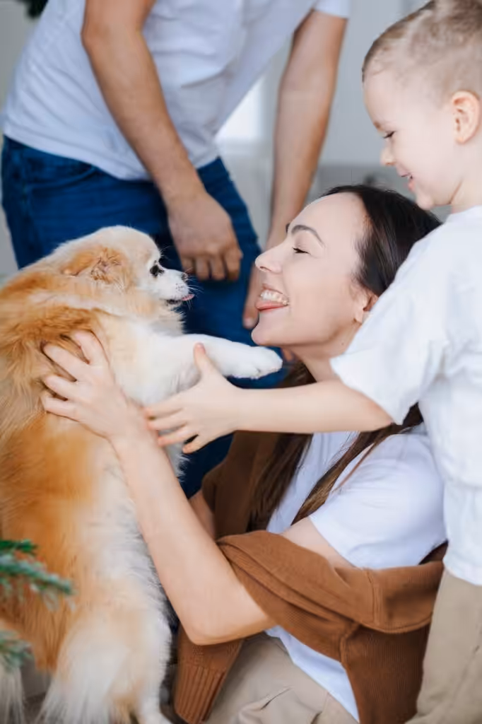 Family playing with their dog
