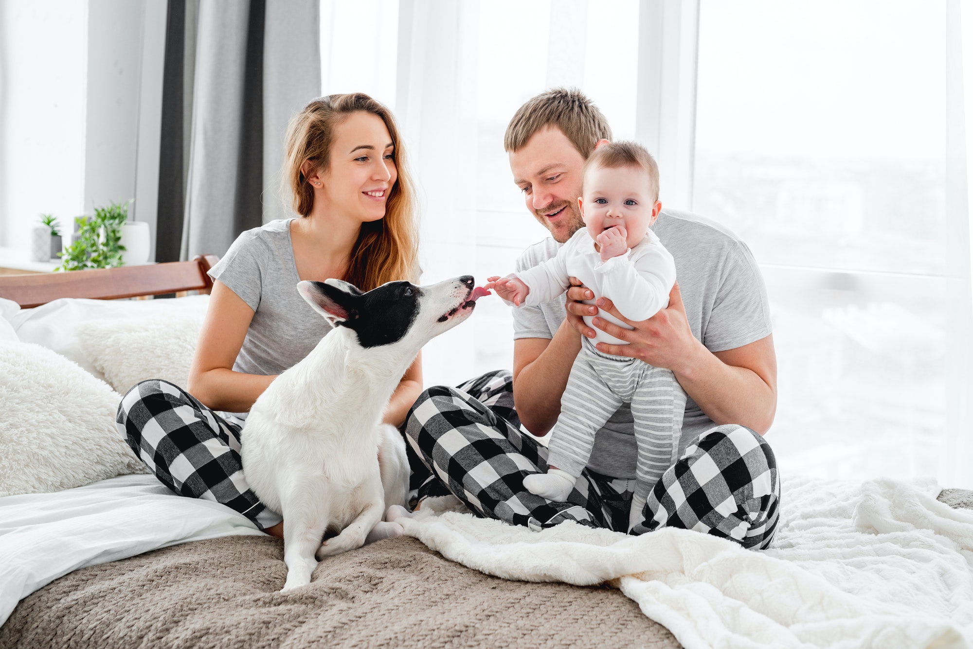 Family with dog in the bed