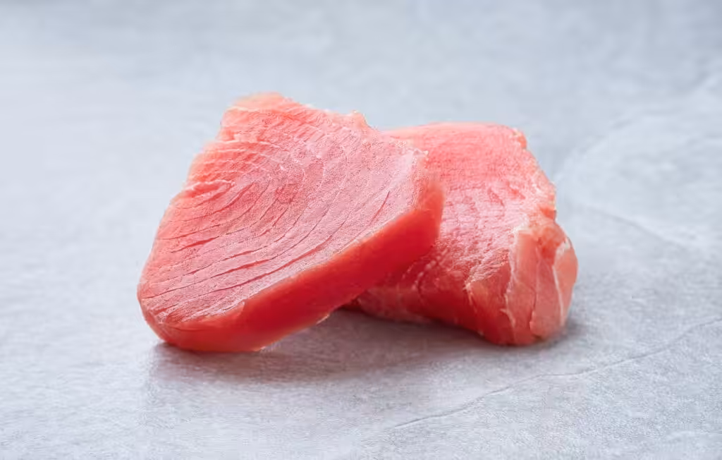 Fresh tuna steak on gray background. Sashimi sushi