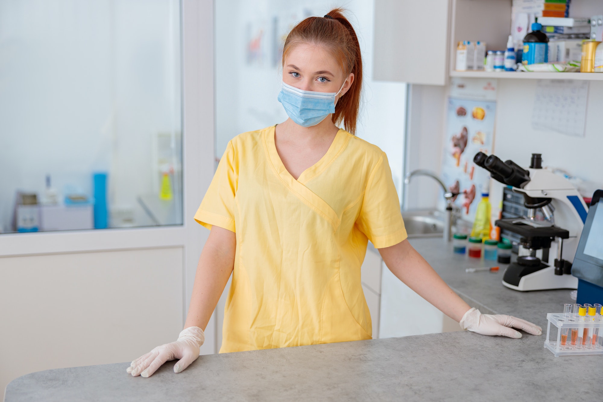 Woman vet standing in interior of modern clinic